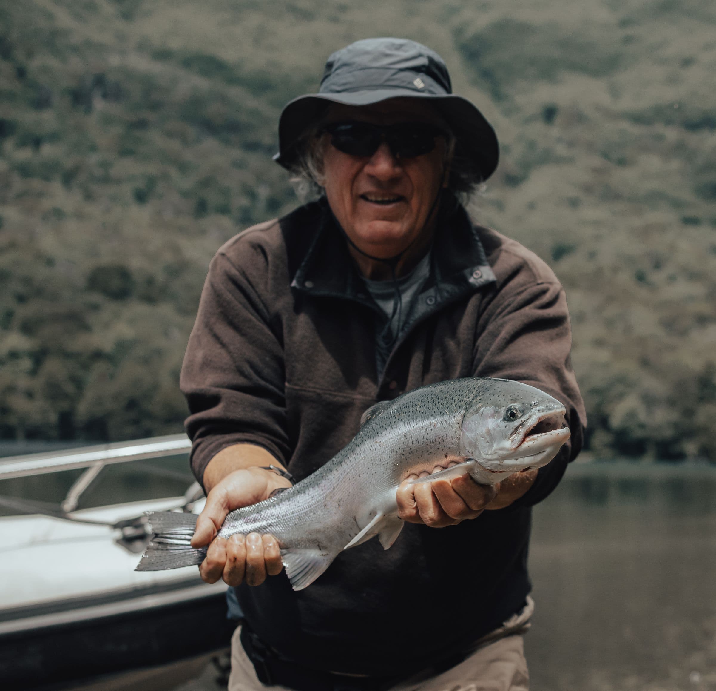 Angler holding a freshly caught rainbow trout